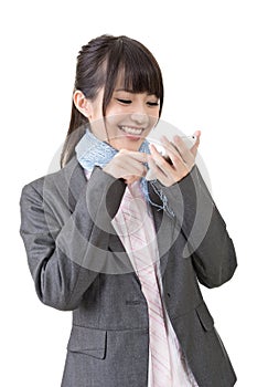 Asian business woman type on cell phone