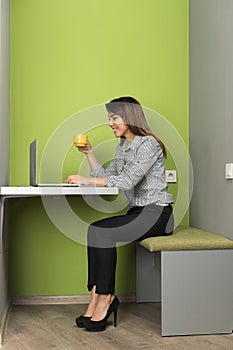 Asian Business Woman Using Laptop Computer Businesswoman In Coworking Center Cafe Hold Cup