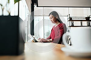 Asian Business Woman Working In Bar Outside Office