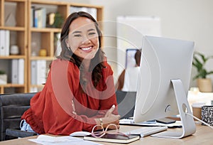 Asian business woman, working on computer at desk in office or company workplace with a smile. Portrait, happy employee