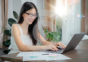 Asian business woman working in home office