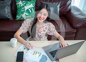 Asian business woman working in home office