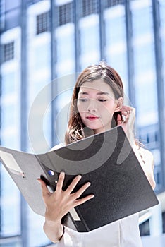 The asian business woman working and operation in outside office