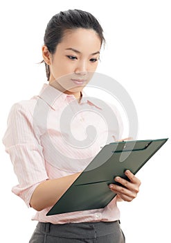 Asian business woman write on file pad