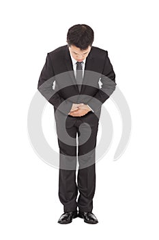 asian businessman with bow and kindly gesture