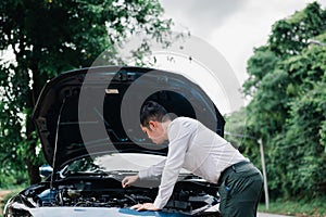 Asian businessman broken car engine breakdown