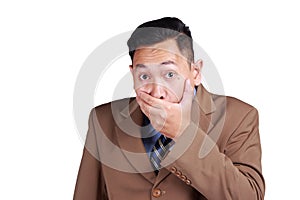 Asian businessman closing his mouth with fingers