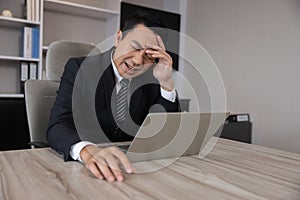 Asian Businessman Grab His Head with Migraine Headache
