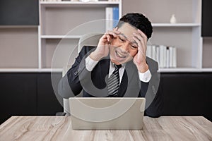 Asian Businessman Grab His Head with Migraine Headache