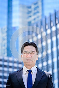 The asian businessman has thinking of vision with building and c