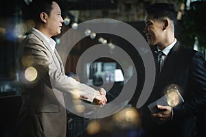 Asian businessman having handshake for business deal and agreement