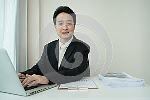 Asian businessman having a online meeting at home.