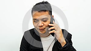 Asian businessman having a serious talk and conversation on the phone