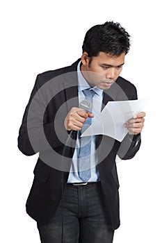 Asian businessman hesitate to speak look at a paper