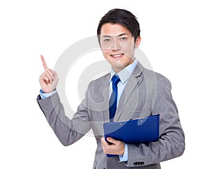 Asian businessman hold with clipboard and finger point up