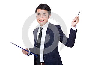 Asian businessman hold clipboard and pen point up