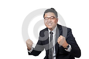 Asian businessman hold his fists happy with success