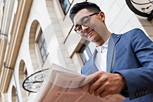 Asian businessman with newspaper