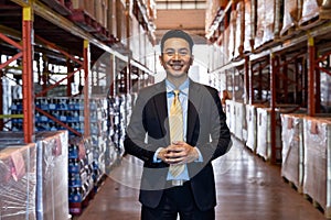 Asian businessman owner portrait in distribution warehouse