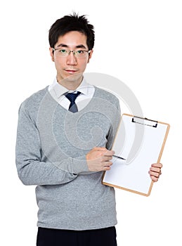 Asian businessman pen point to white paper of clipboard