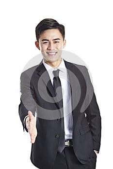 Asian businessman reaching out for handshake