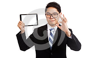 Asian businessman show OK with tablet pc