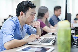 Asian Businessman Sitting At Desk Working Laptop Computer Business