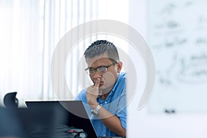 Asian Businessman Sitting Desk Working Laptop Pondering