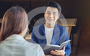 Asian businessman smiling in a friendly to meet business talk