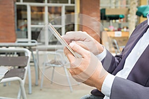 Asian Businessman in Suit use Digital Wireless Tablet outdoor in
