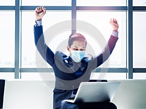 Asian businessman in suit wearing protective face mask