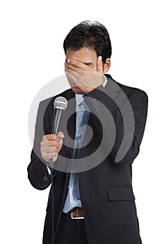 Asian businessman to shy to speak close his face