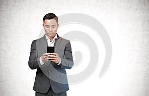 Asian businessman using smartphone, mock up