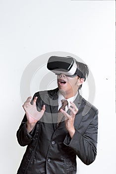 Asian Businessman wearing virtual reality on white background