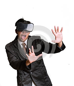 Asian Businessman wearing virtual reality on white background