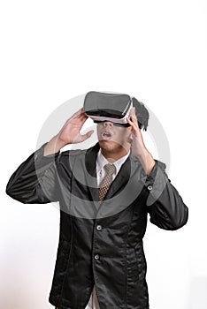 Asian Businessman wearing virtual reality on white background