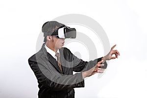 Asian Businessman wearing virtual reality on white background