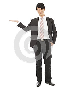 Asian businessman with welcome and showing gesture