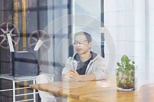 Asian businessman working on laptop in office alone