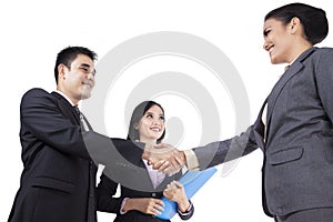 Asian businesspeople handshaking