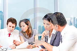 Asian Businesspeople having meeting in office