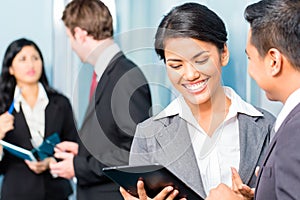 Asian Businesspeople having meeting in office