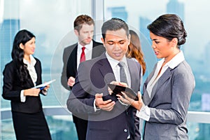 Asian Businesspeople having meeting in office