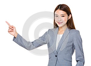 Asian businessswoman with finger point upwards
