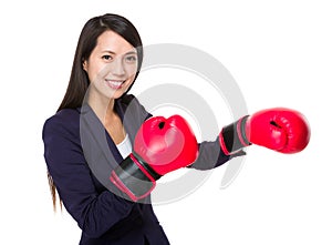 Asian businesswoman with boxing gloves
