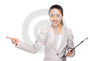 Asian businesswoman with clipboard and finger point out
