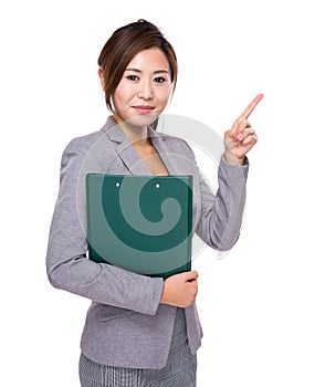 Asian businesswoman with clipboard and finger point up