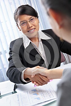 Asian businesswoman handshake with client