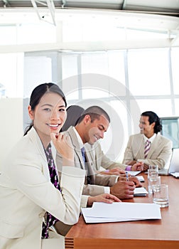 Asian businesswoman and her team during a presenta photo