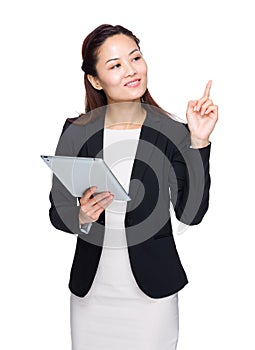 Asian businesswoman hold tablet and finger point up